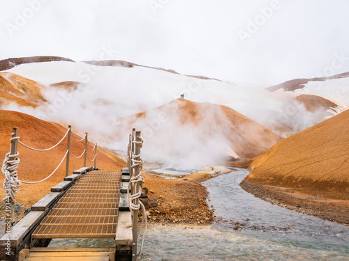 Iceland, Southern Region, Small bridge in Hveradalir hot springs photo