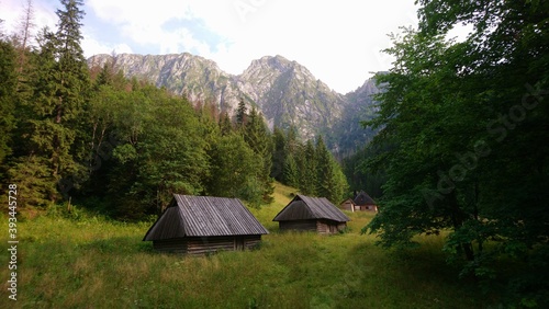 Wooden huts on the background of the Giewont Mountain