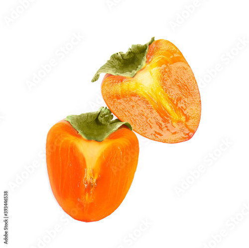 Delicious cut fresh persimmon isolated on white, top view