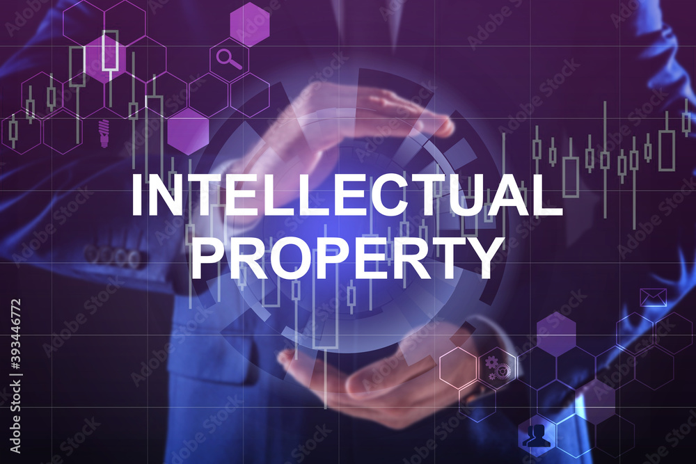 Intellectual property concept. Man using virtual screen with schemes, closeup Intellectual property concept. Man using virtual screen with schemes, closeup