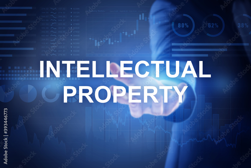 Intellectual property concept. Man using virtual screen with schemes, closeup Intellectual property concept. Man using virtual screen with schemes, closeup