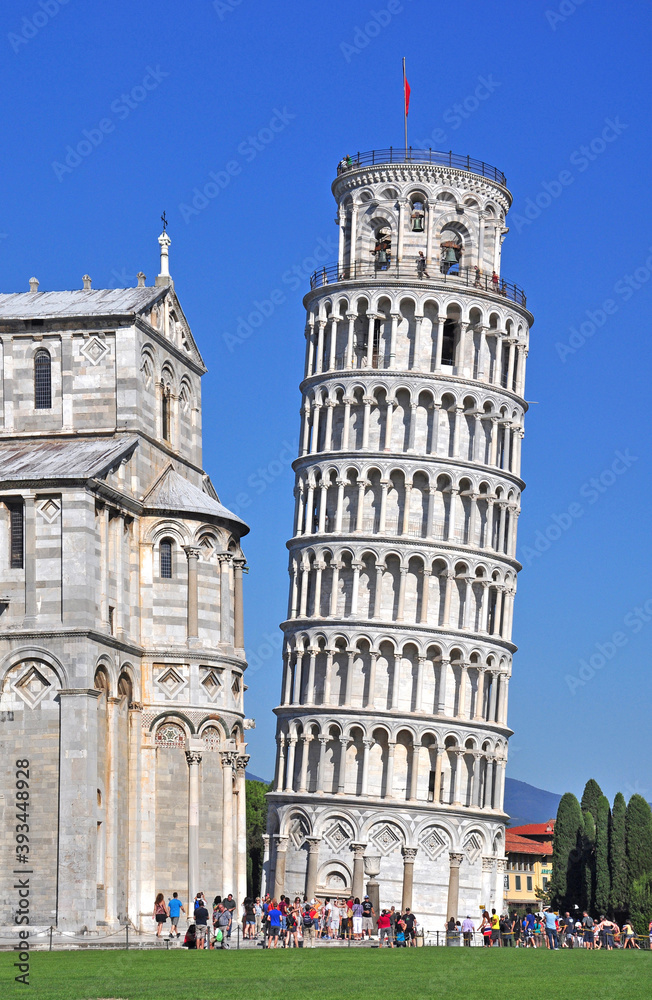 The Leaning Tower of Pisa. The beautiful tower, the campanile or bell tower of the Basilica is seen leaning in comparison to the Basilica. The tower leans 4 degrees from vertical at present.