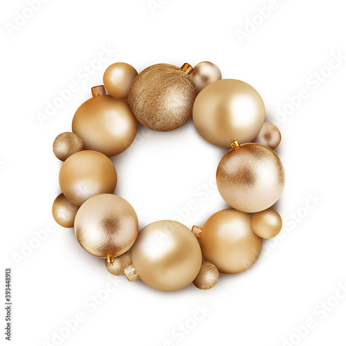 Beautiful festive wreath of golden Christmas balls on white background, top view