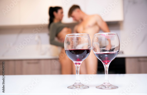 Couple during romantic date. Wine glasses. Alcohol. Lovers. Couple in love. 