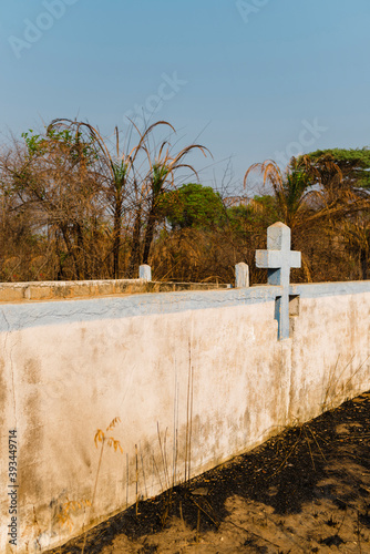 Tomb close to the road on burned landscape photo