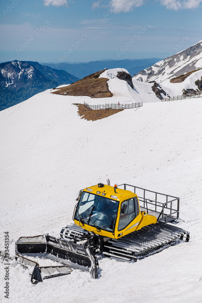 Yellow ratrack on the side of a mountain Yellow ratrack on the side of a mountain