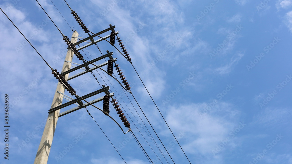 Ceramic insulators with high voltage wires on the poles. Brown ...