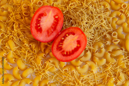 Sopa de pasta con jitomate partido a la mitad  photo