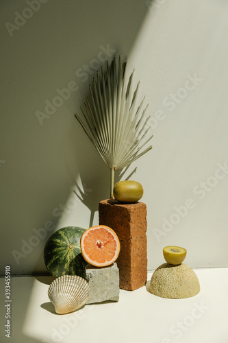 styled still life of fruit and textures in bright studio photo