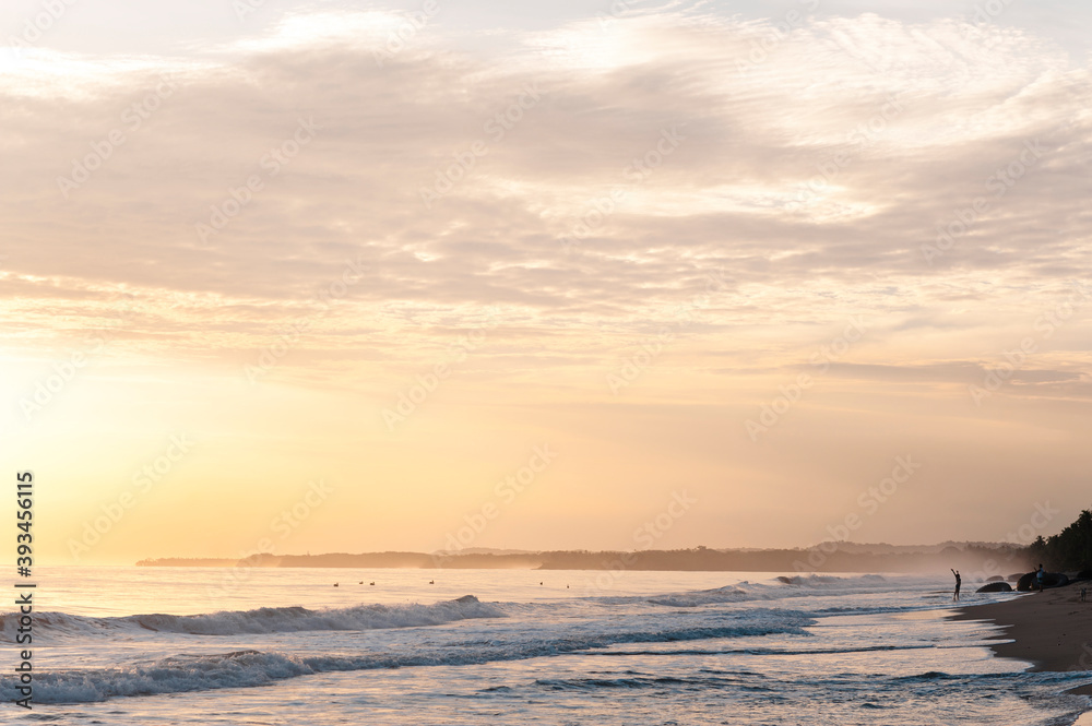 Anonymous people joyning beach at sunrise Anonymous people joyning beach at sunrise