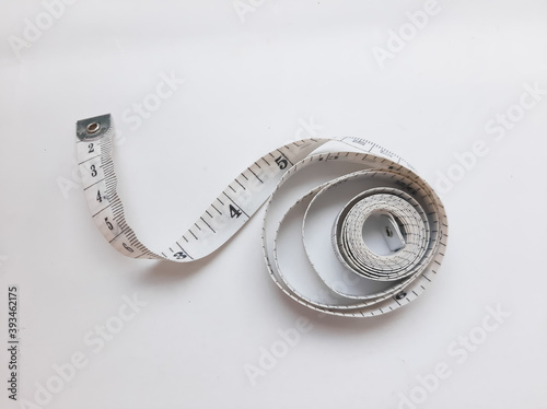 spiral measuring tape on a white background