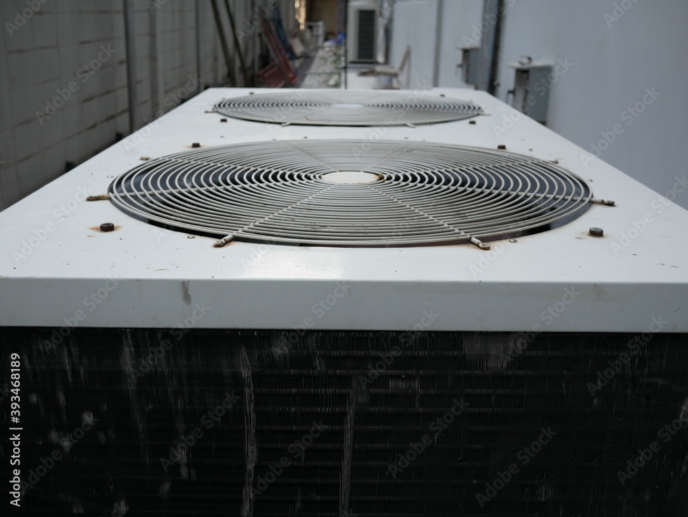 air conditioner compressor outside building.
air conditioner compressor outside building.