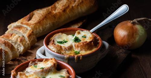 Close up of French onion soup in soup crocks ready for eating.