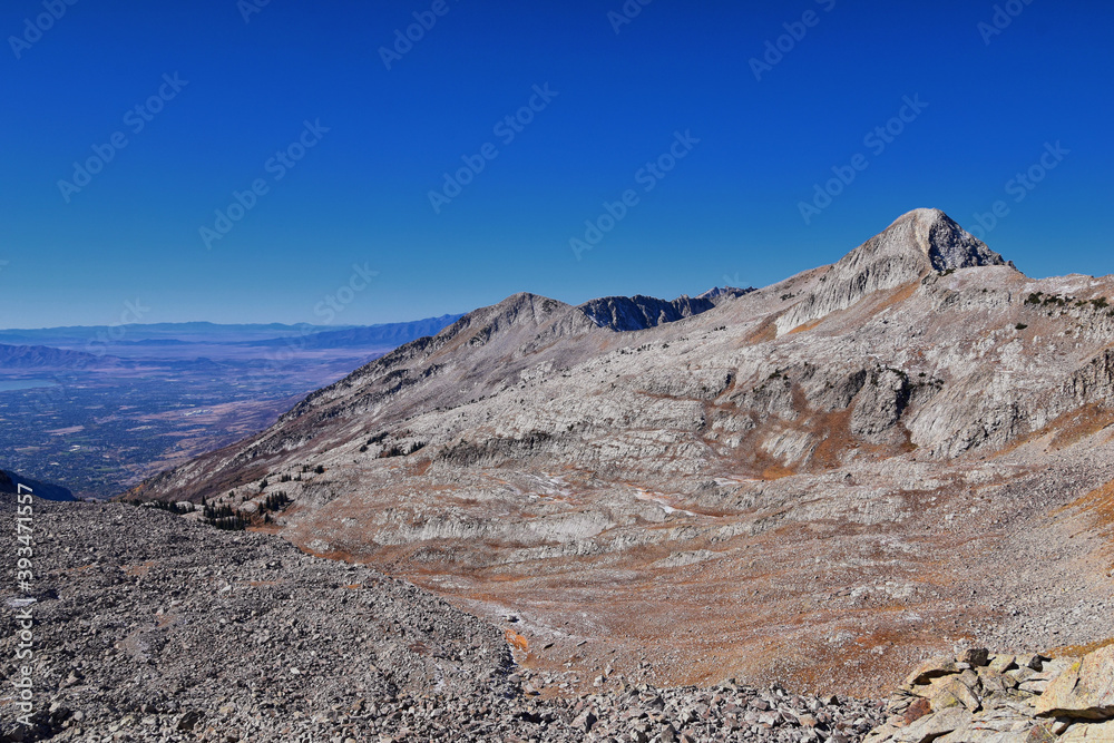 View of Pfeifferhorn peak and Lone Peak Wilderness mountain landscape from White Baldy and Pfeifferhorn trail, towards Salt Lake Valley, Wasatch Rocky mountain range, Utah, United States. 