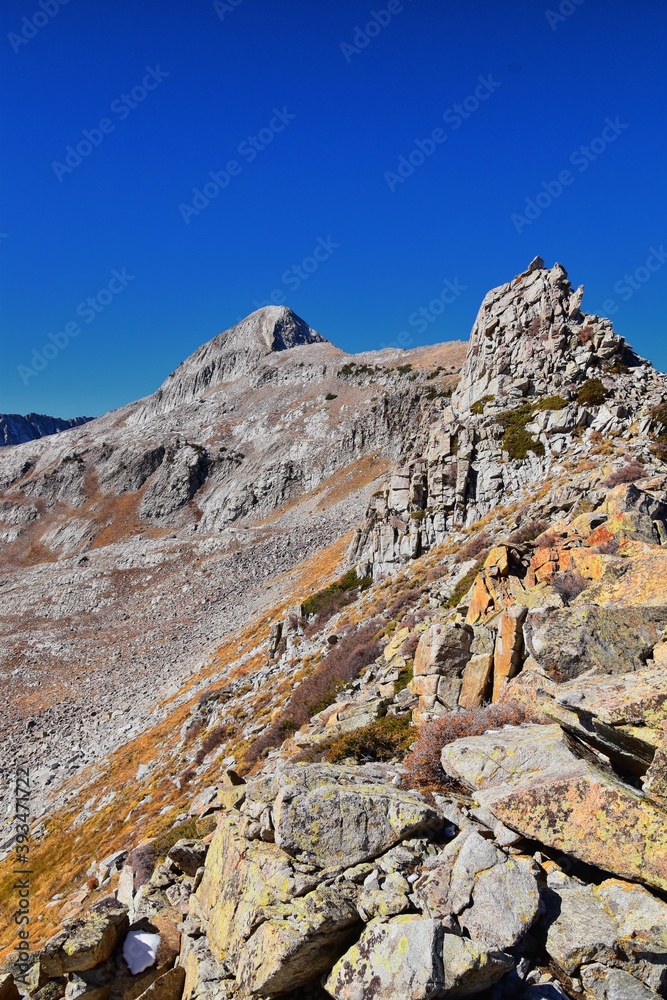 View of Pfeifferhorn peak and Lone Peak Wilderness mountain landscape from White Baldy and Pfeifferhorn trail, towards Salt Lake Valley, Wasatch Rocky mountain range, Utah, United States. 