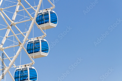 white giant wheel with blue glass, known as Rio Star, located in the Olympic boulevard