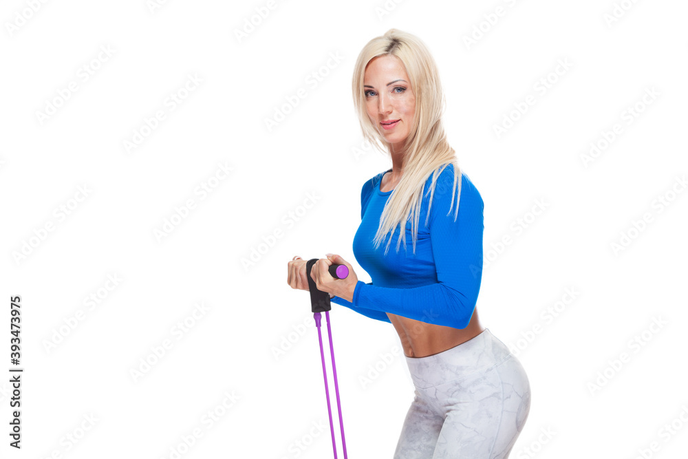 Side view of blonde fitness girl exercising with fitness expander isolated on white background Side view of blonde fitness girl exercising with fitness expander isolated on white background