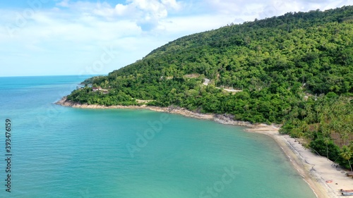 Beach and Sea and mountain Top View , Wave of Turquoise ocean water on sandy beach, High angle view sea and sand background, Aerial top view of Khanom beach, Khanom, Nakhon Si Thammarat Thailand  © Nuttawut
