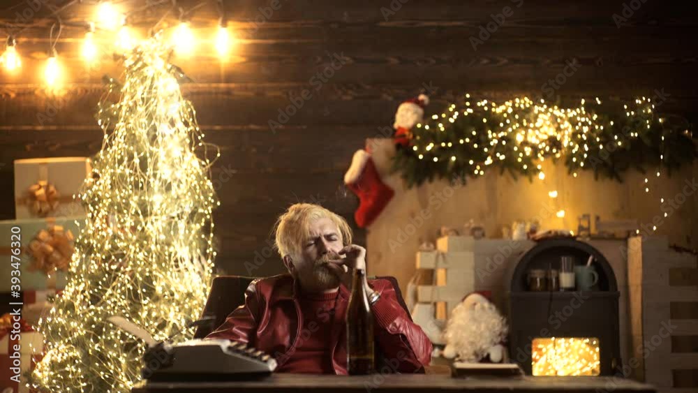santa smoking cigarette Drunken Santa smoking cigarette with sad expression. Bad modern santa claus  sitting at table and looking at camera