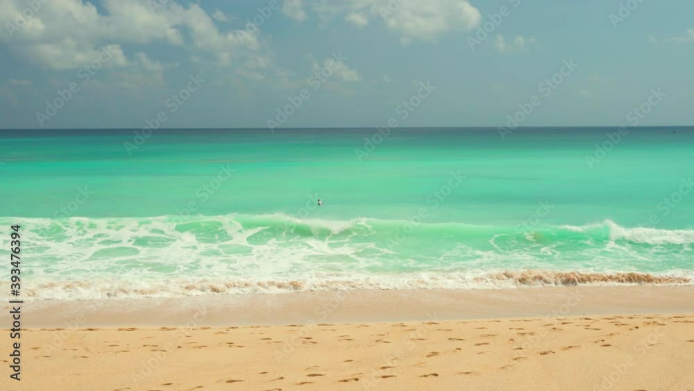 Dreamland Beach is one of the most famous and popular beaches in Bali famous for its sandy beach and crystal clear azure seawater and great waves for exciting surfing. 4K Dreamland Beach is one of the most famous and popular beaches in Bali famous for its sandy beach and crystal clear azure seawater and great waves for exciting surfing. 4K