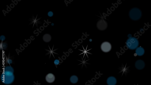 Soft focus light circles and stars particles over dark background - computer illustration graphics element Christmas celebration background