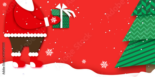 Merry Christmas Greetings Card with Santa Claus hands holding green giftbox with white bow. Magic Cristmas tree. Happy New Year in papercraft style. Red background. Winter holidays.