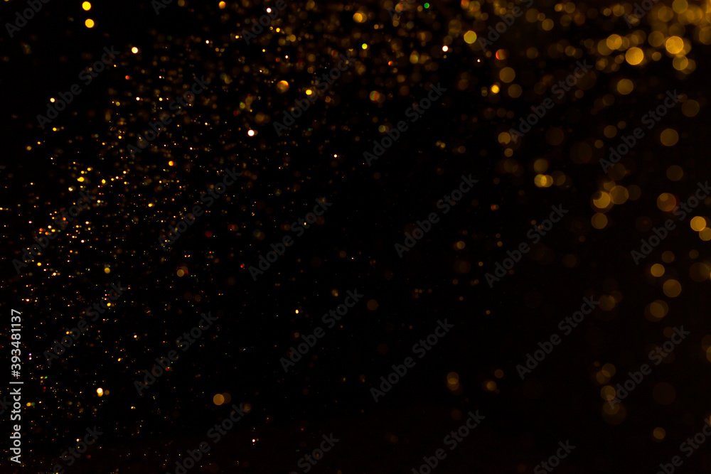 Abstract gold bokeh with black background