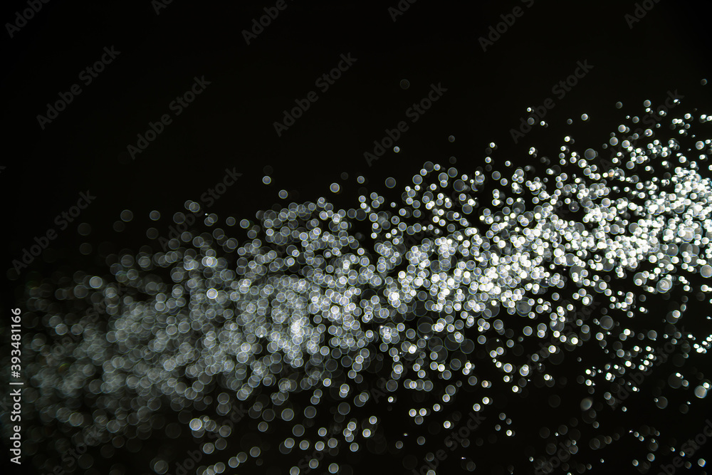 Abstract white bokeh with black background Abstract white bokeh with black background