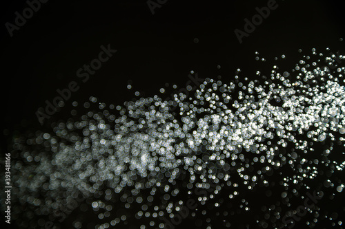 Abstract white bokeh with black background