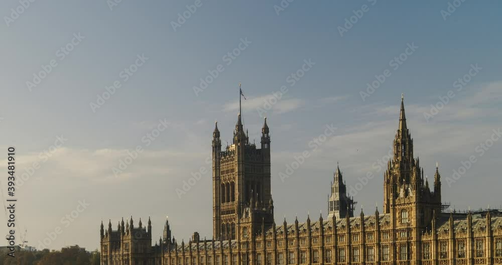 Timelapse of London, time lapse of Houses of Parliament, the iconic building and tourist attraction with clouds moving in bright blue sky, shot in Coronavirus Covid-19 lockdown in England, UK Timelapse of London, time lapse of Houses of Parliament, the iconic building and tourist attraction with clouds moving in bright blue sky, shot in Coronavirus Covid-19 lockdown in England, UK