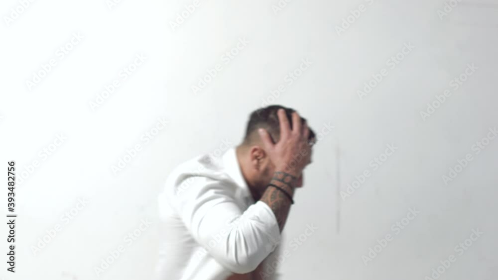 Angry and mad man screaming. Furious while shouting with anger. Upset unhappy young man in white shirt. Rage and aggressive concept. Screaming brutal guy. Face expression. Crazy man. Angry and mad man screaming. Furious while shouting with anger. Upset unhappy young man in white shirt. Rage and aggressive concept. Screaming brutal guy. Face expression. Crazy man.