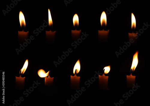 flame candle set in the dark 