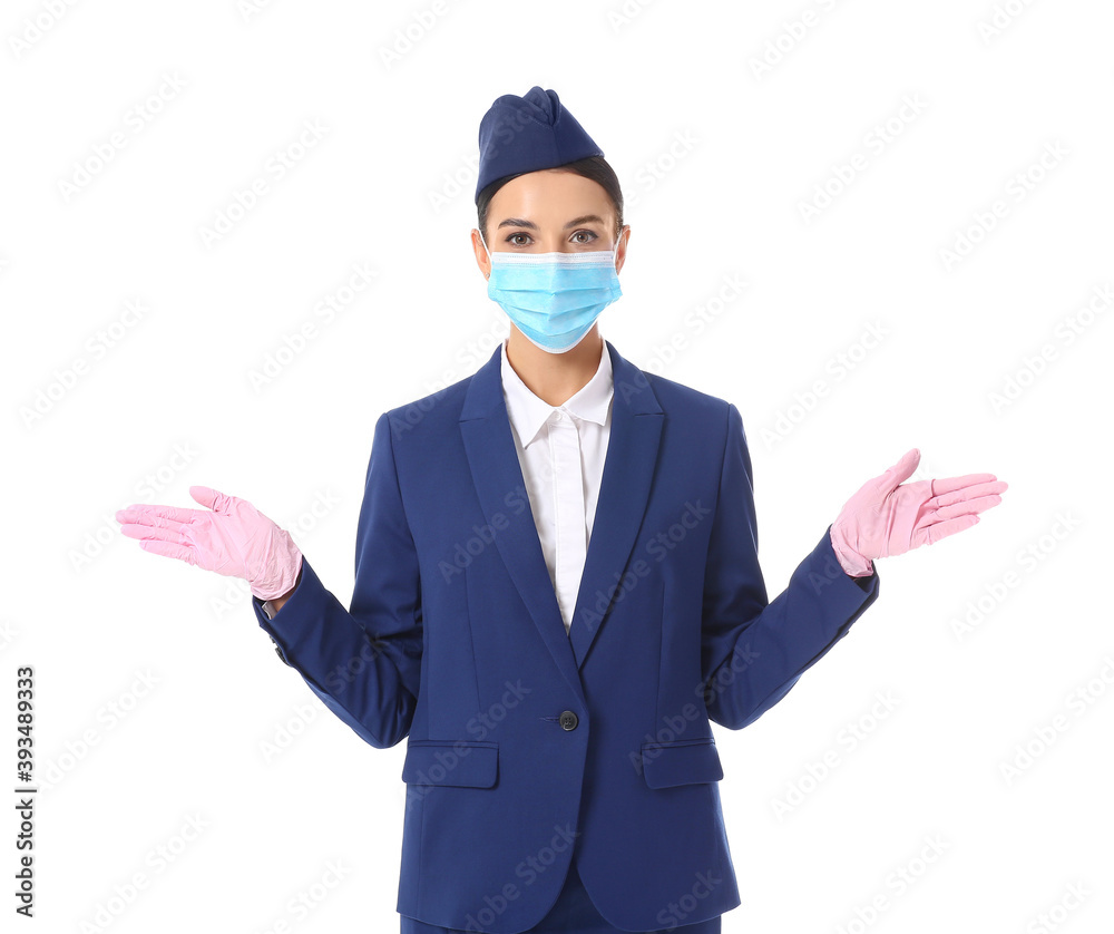 Beautiful stewardess in medical mask on white background Beautiful stewardess in medical mask on white background
