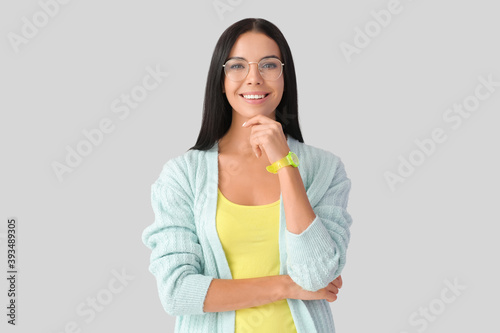 Young woman with wristwatch...