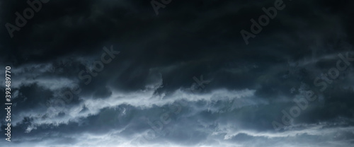 The typhoon is born, a tornado in a stormy dark sky with black clouds and a strong wind. Panoramic image. Concept on the theme of weather, natural disasters.