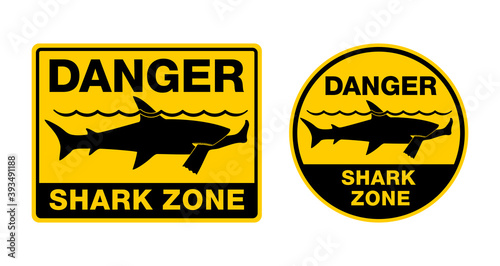 Danger Shark Zone - Beware of sharks - caution attention sign for dangerous beach territory - predatory fish bit off a human leg