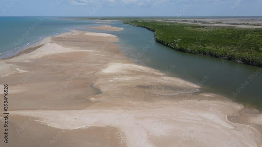 Aerial drone shot of Buffalo creek Leading to ocean, with Sandy beach and Dense bushland near Lee Point, Darwin, Northern Territory Aerial drone shot of Buffalo creek Leading to ocean, with Sandy beach and Dense bushland near Lee Point, Darwin, Northern Territory