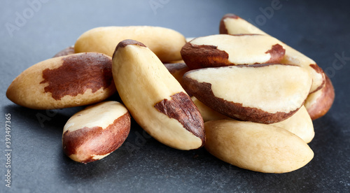 Close up picture of Brazil nuts on a dark background, selective focus.