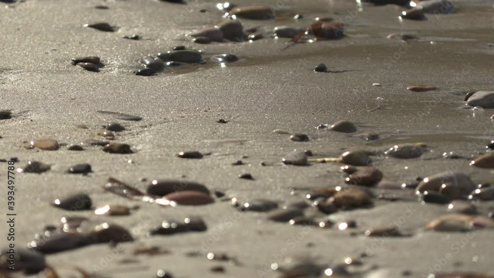 Static shot of how the sand drains the water in Cala Benirras, Ibiza, Spain. 4K. Pro Res Static shot of how the sand drains the water in Cala Benirras, Ibiza, Spain. 4K. Pro Res