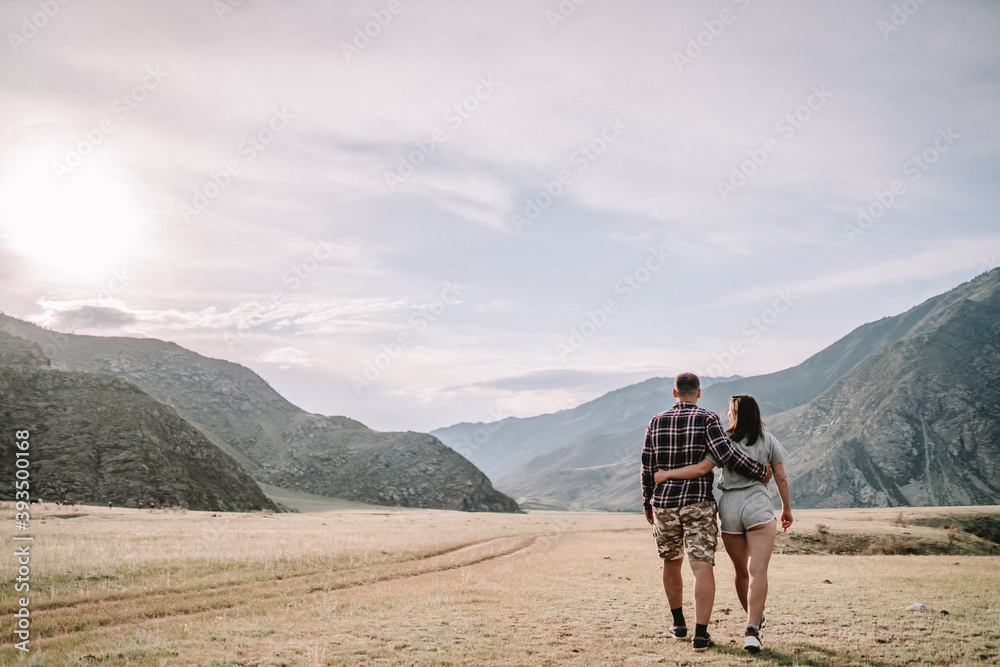 Fototapeta premium couple walking on the meadow