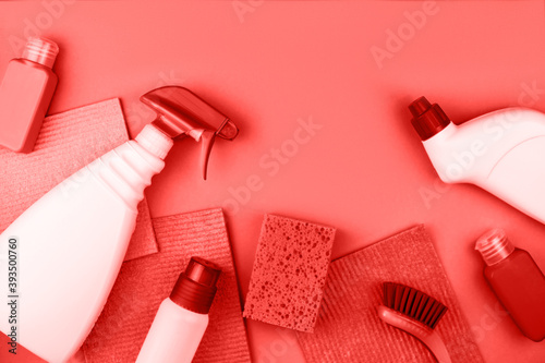 House cleaning products are on red background.