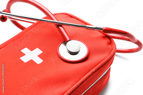 Red first aid kit with stet...