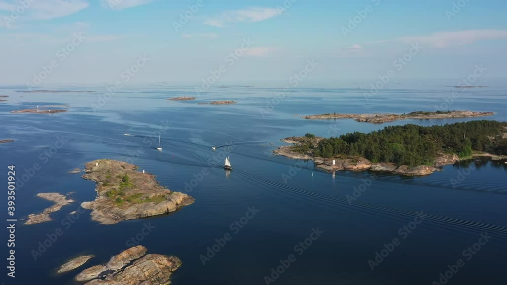 Sailing Boats Navigate in Deep Blue Waters of Finnish Archipelago in Summer, Aerial Orbit Sailing Boats Navigate in Deep Blue Waters of Finnish Archipelago in Summer, Aerial Orbit
