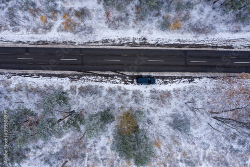 road through winter forest, top view