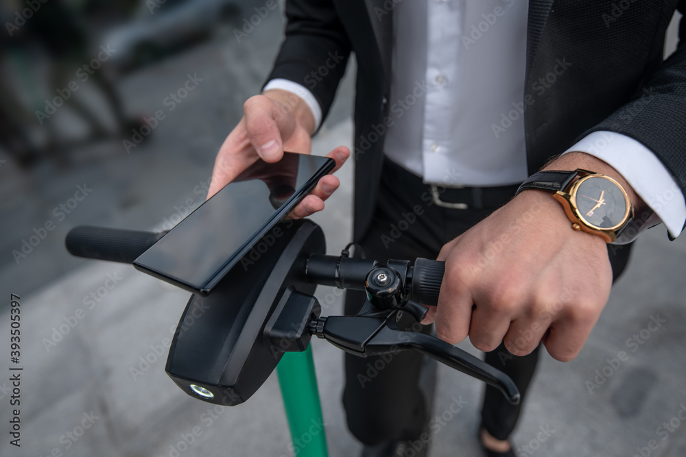 Close up picture of mans hands holding a handle bar Close up picture of mans hands holding a handle bar