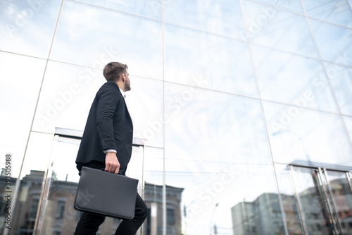 Young businessman going to work to the office