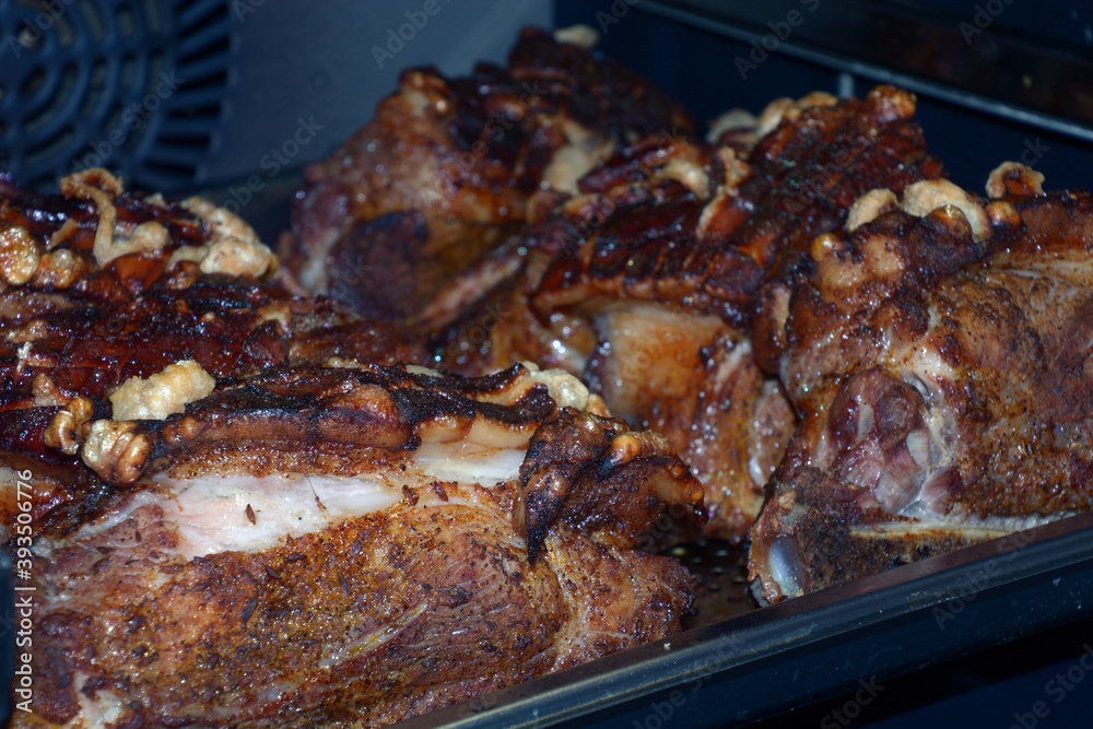 roast pork has a delicious brown and crispy skin in oven for din