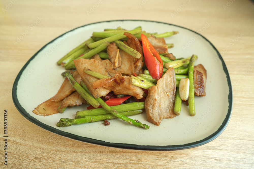 Chinese food, Chinese home cooking dishes, stir-fried pork belly with asparagus and spice Chinese food, Chinese home cooking dishes, stir-fried pork belly with asparagus and spice
