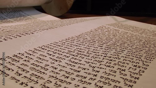 Yad Points to Hebrew in Torah on Bimah, Close Up