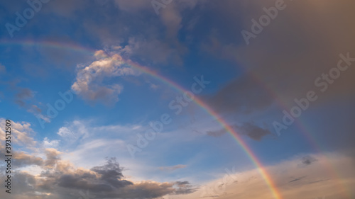 Beautiful rainbow and blues sky background © vadimalekcandr